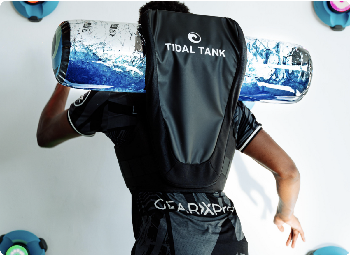 Athlete building strength, balance and power with Tidal Tank water bag training