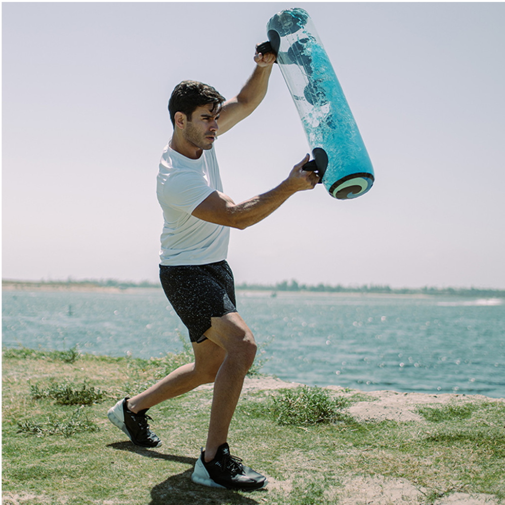 Athlete training with the Tidal Tank water bag outdoors